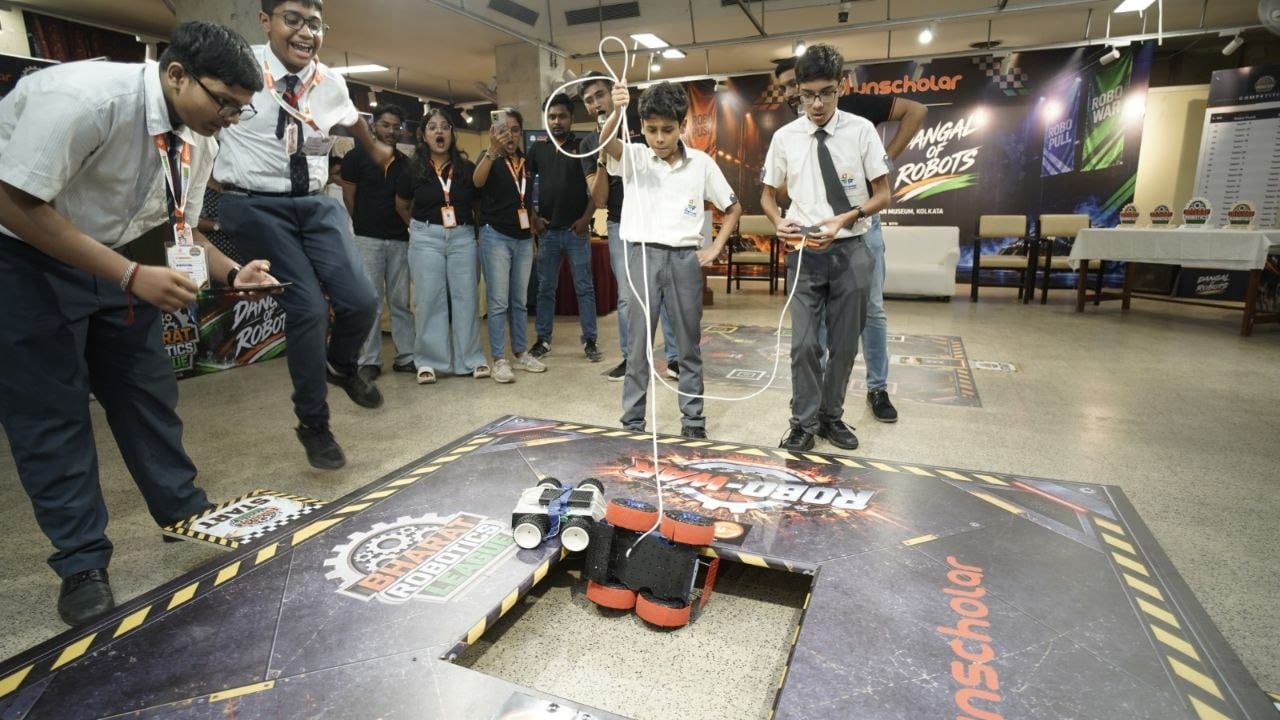Students driving their robot on the Robo-War arena