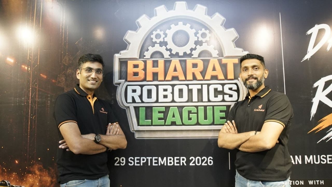 The Funscholar team in front of the Bharat Robotics League backdrop