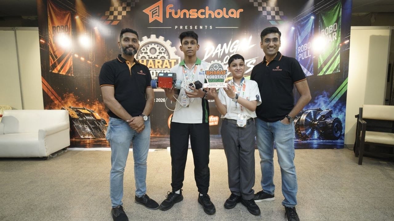 A winning team receiving their trophy from the organisers