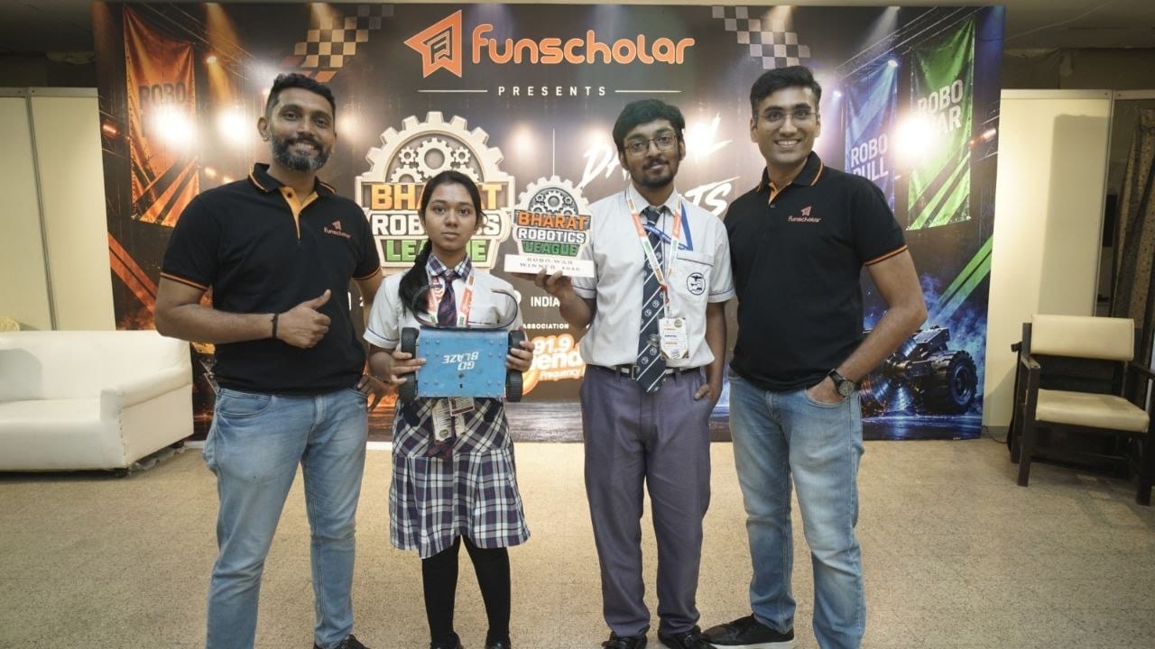 A winning team receiving their trophy from the organisers